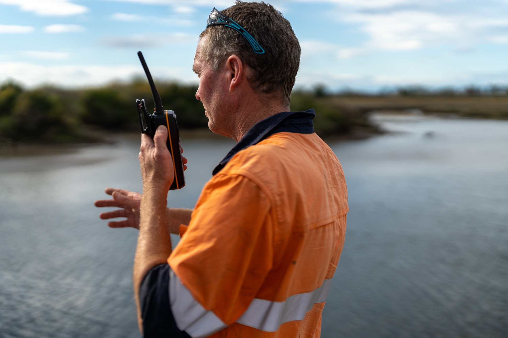 Man using radio from the back