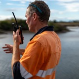 Man using radio from the back