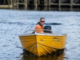 Yellow boat driving towards ramp